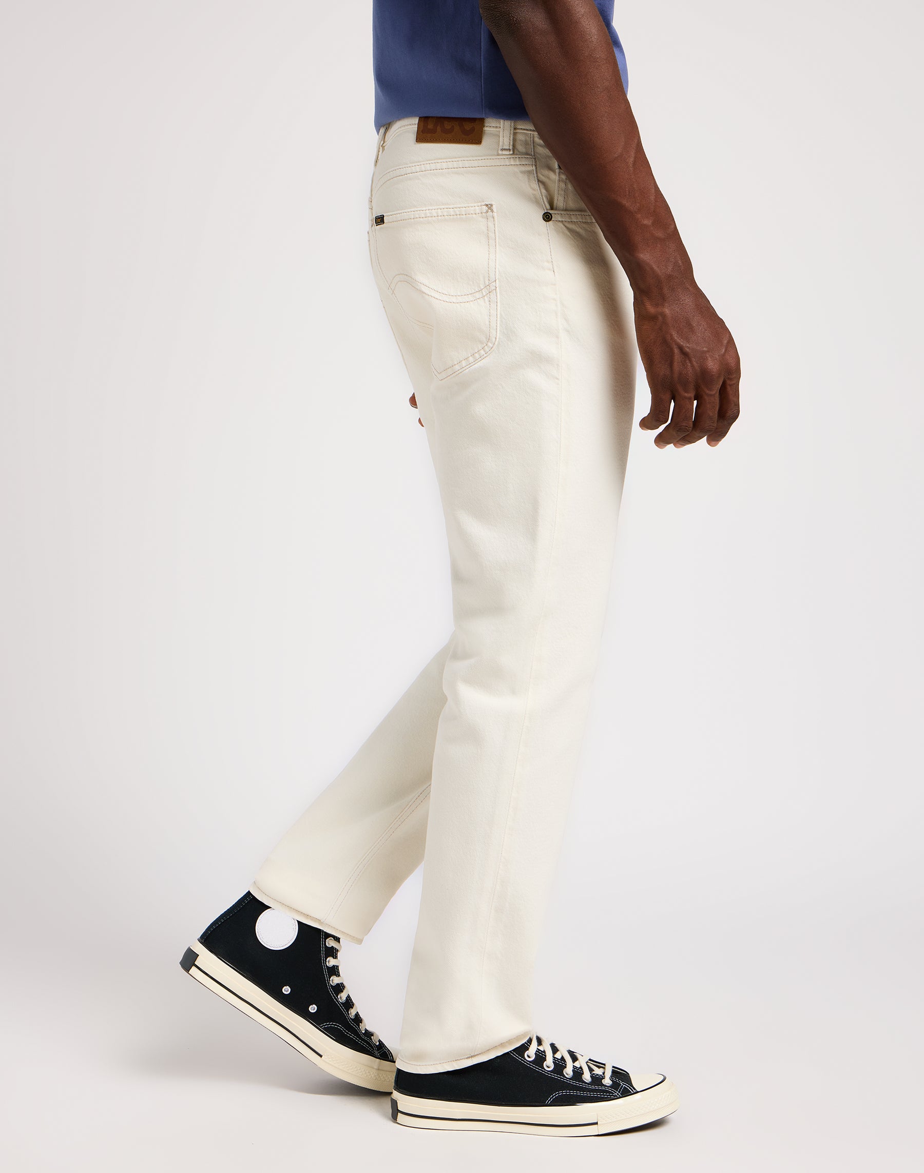 West in off white jeans Lee