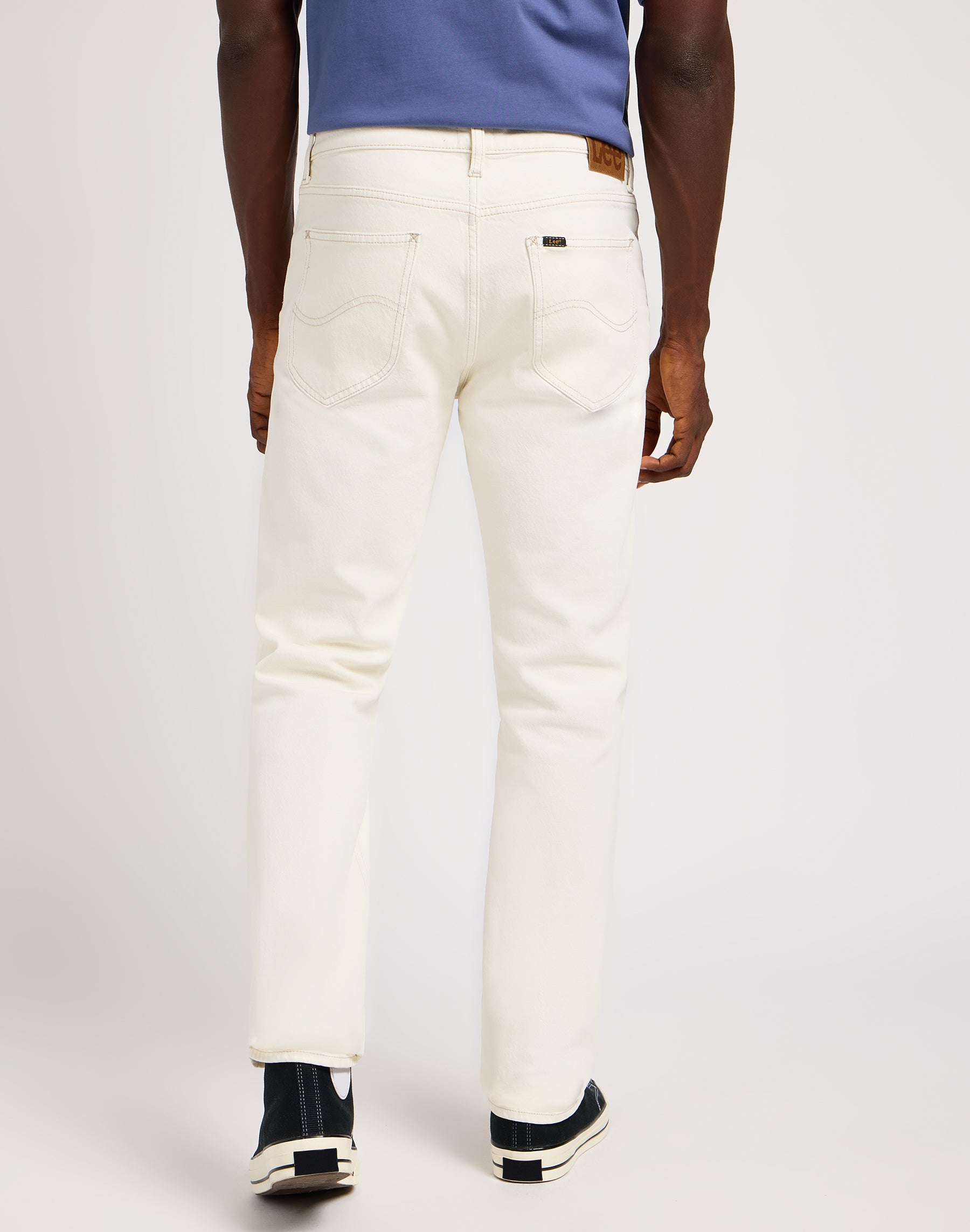 West in off white jeans Lee