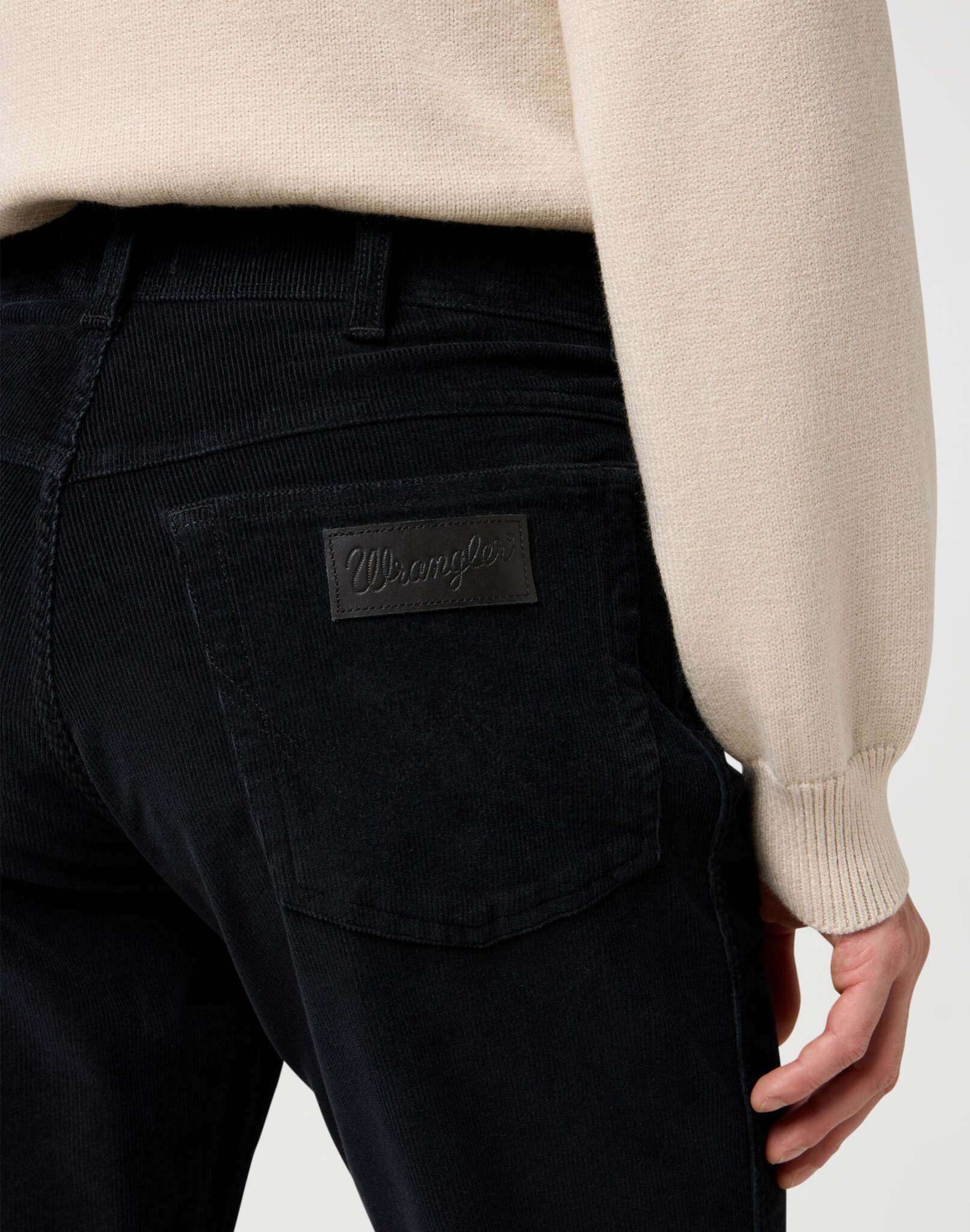 Texas in Black pants Wrangler