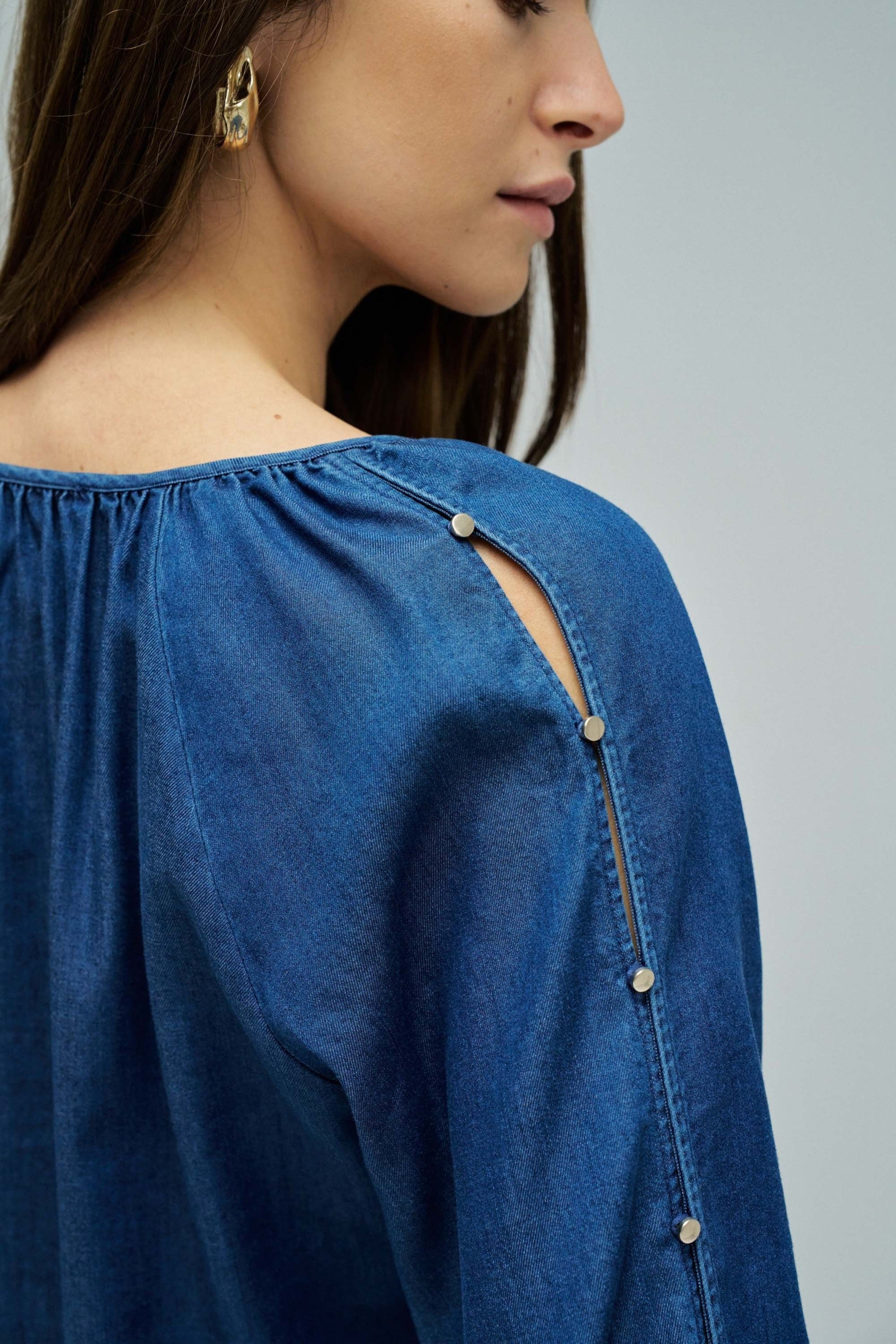 Blouse sleeve detail in dark wash