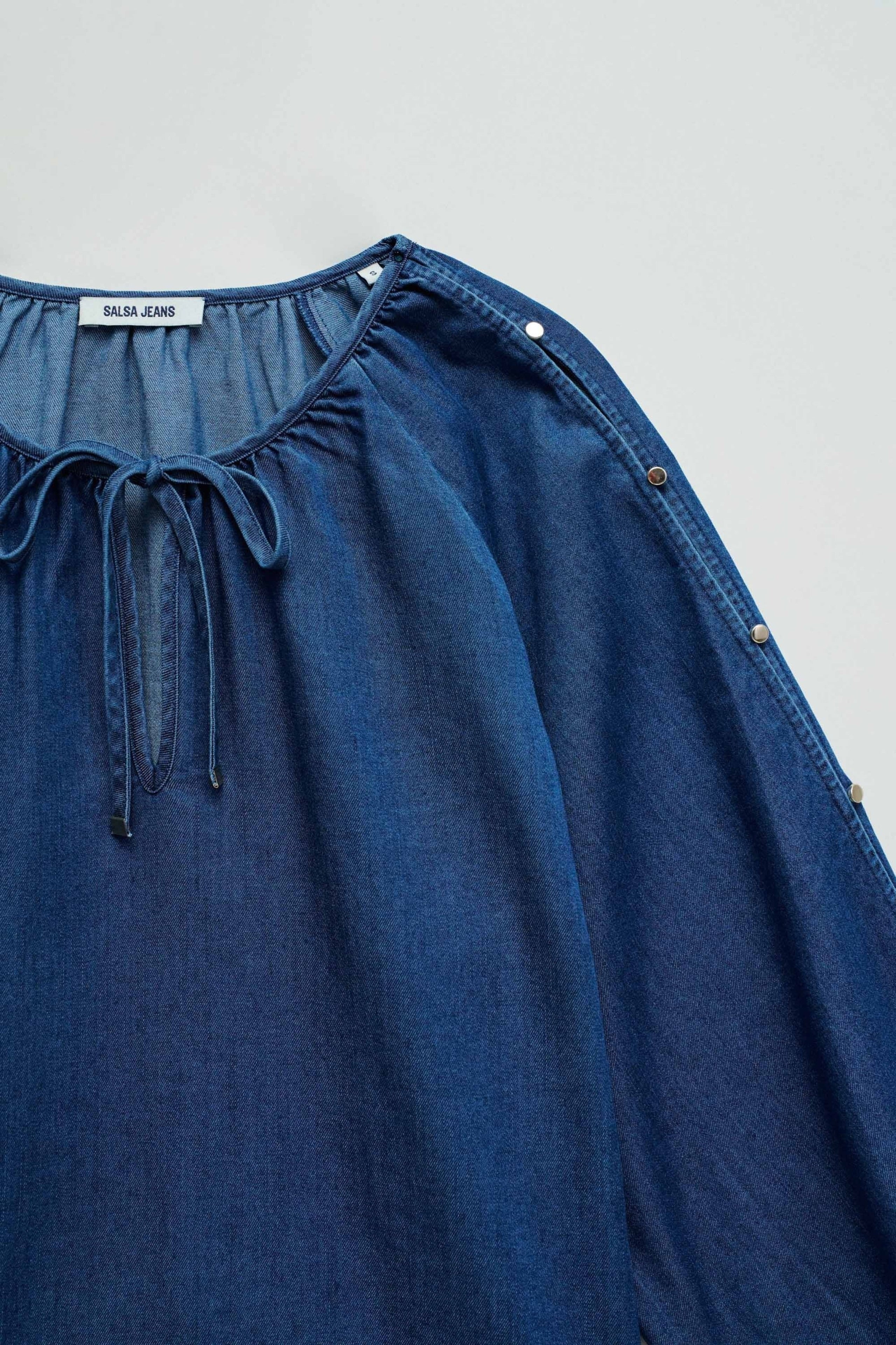 Blouse sleeve detail in dark wash