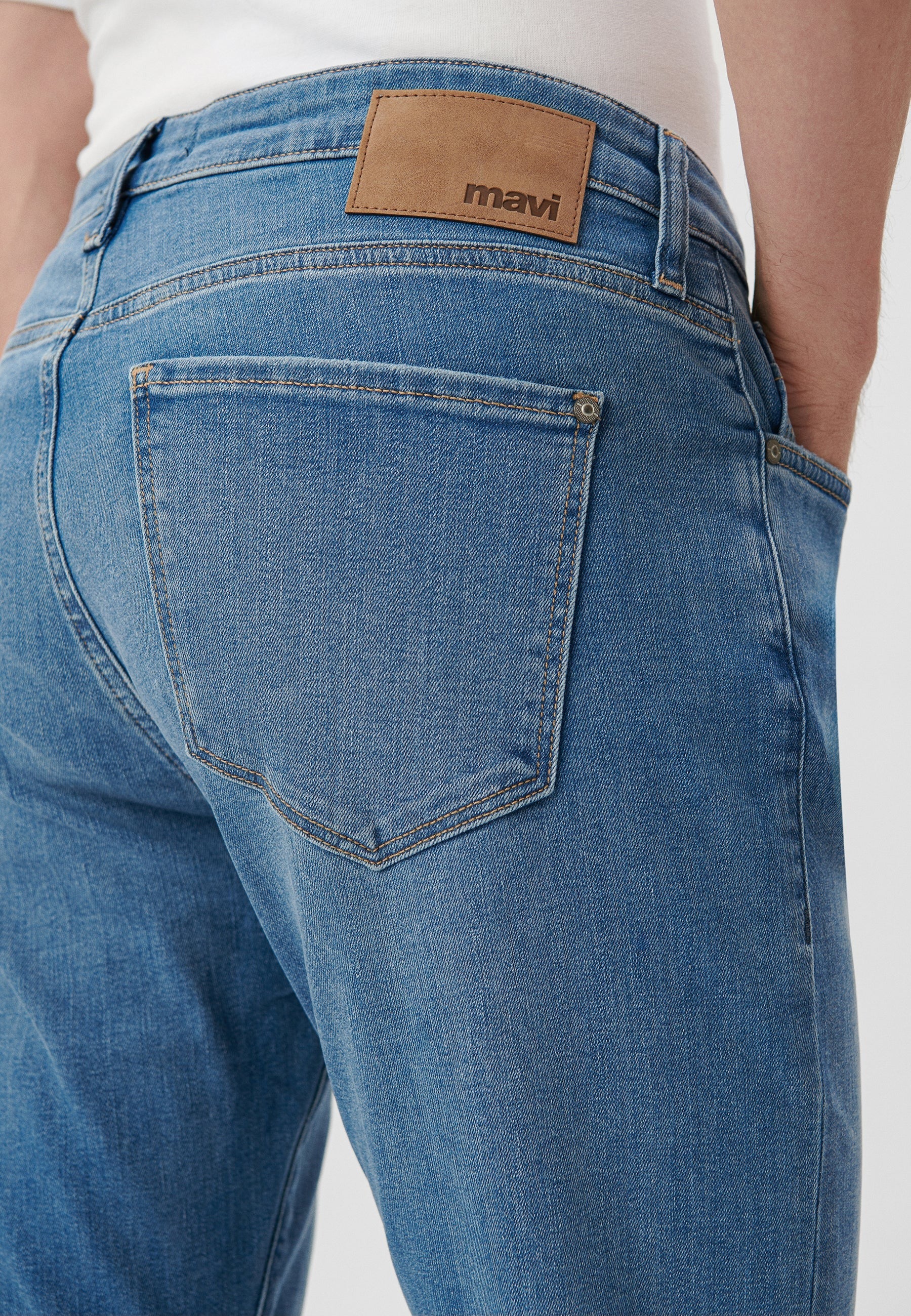 Jake in mid-used jeans by Mavi