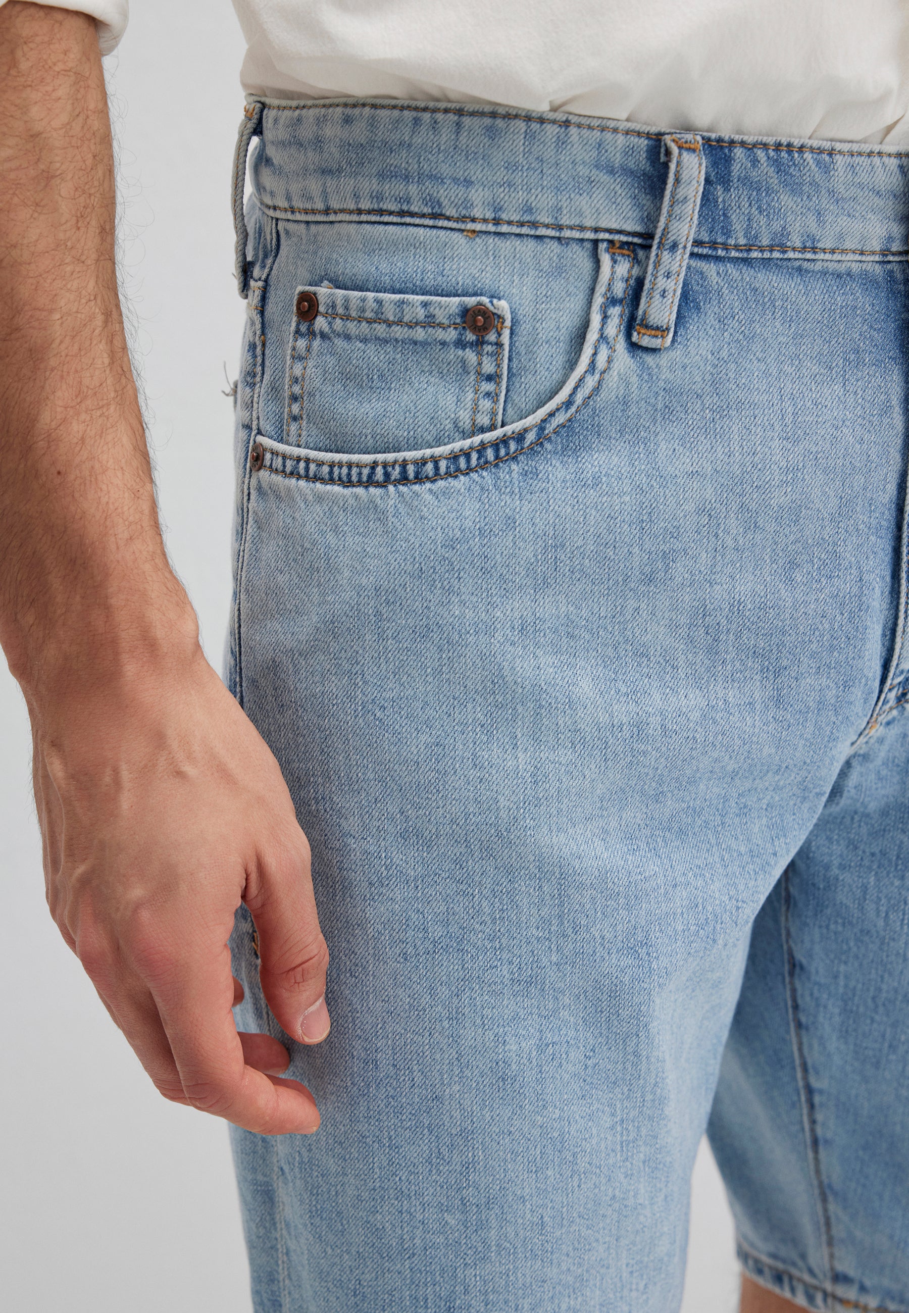 Lucas in Dusty Vintage 90s denim shorts Mavi