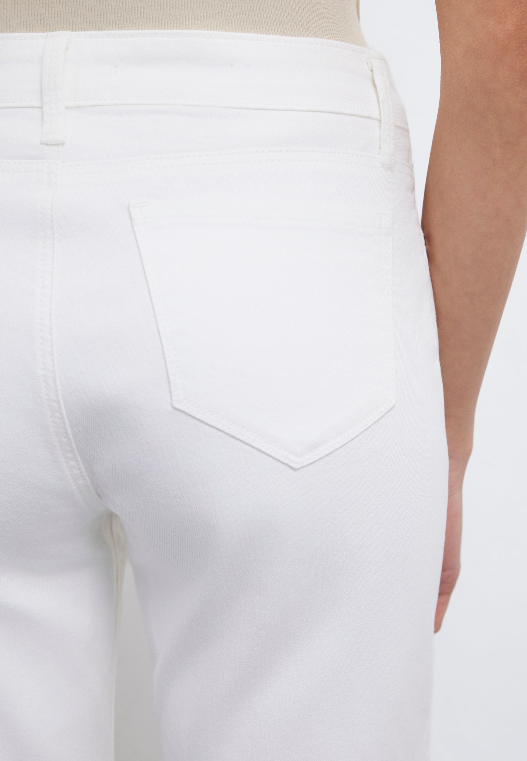 Alexis in white gold denim shorts Mavi