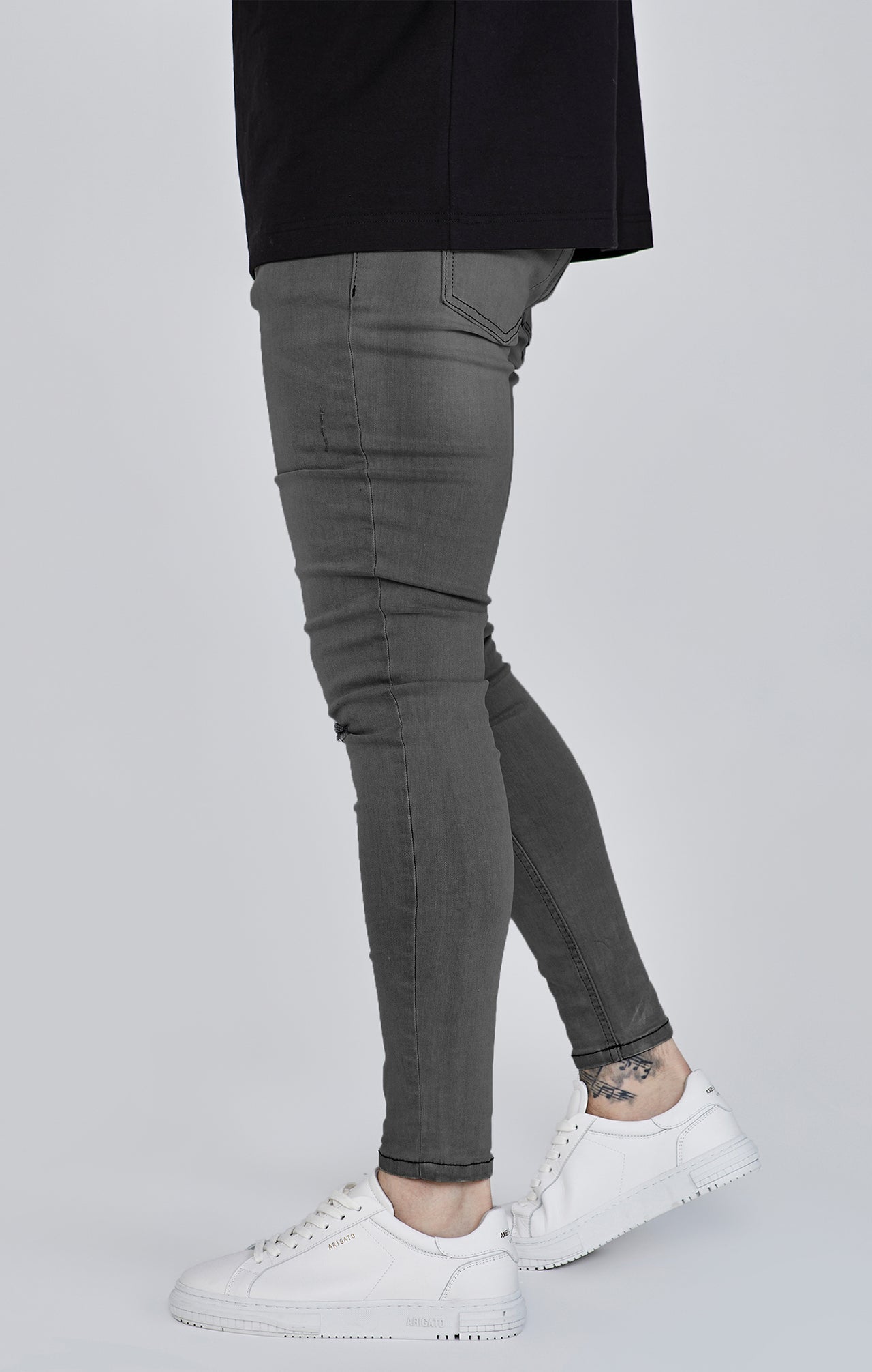 Distressed skinny jeans in gray Jeans SikSilk