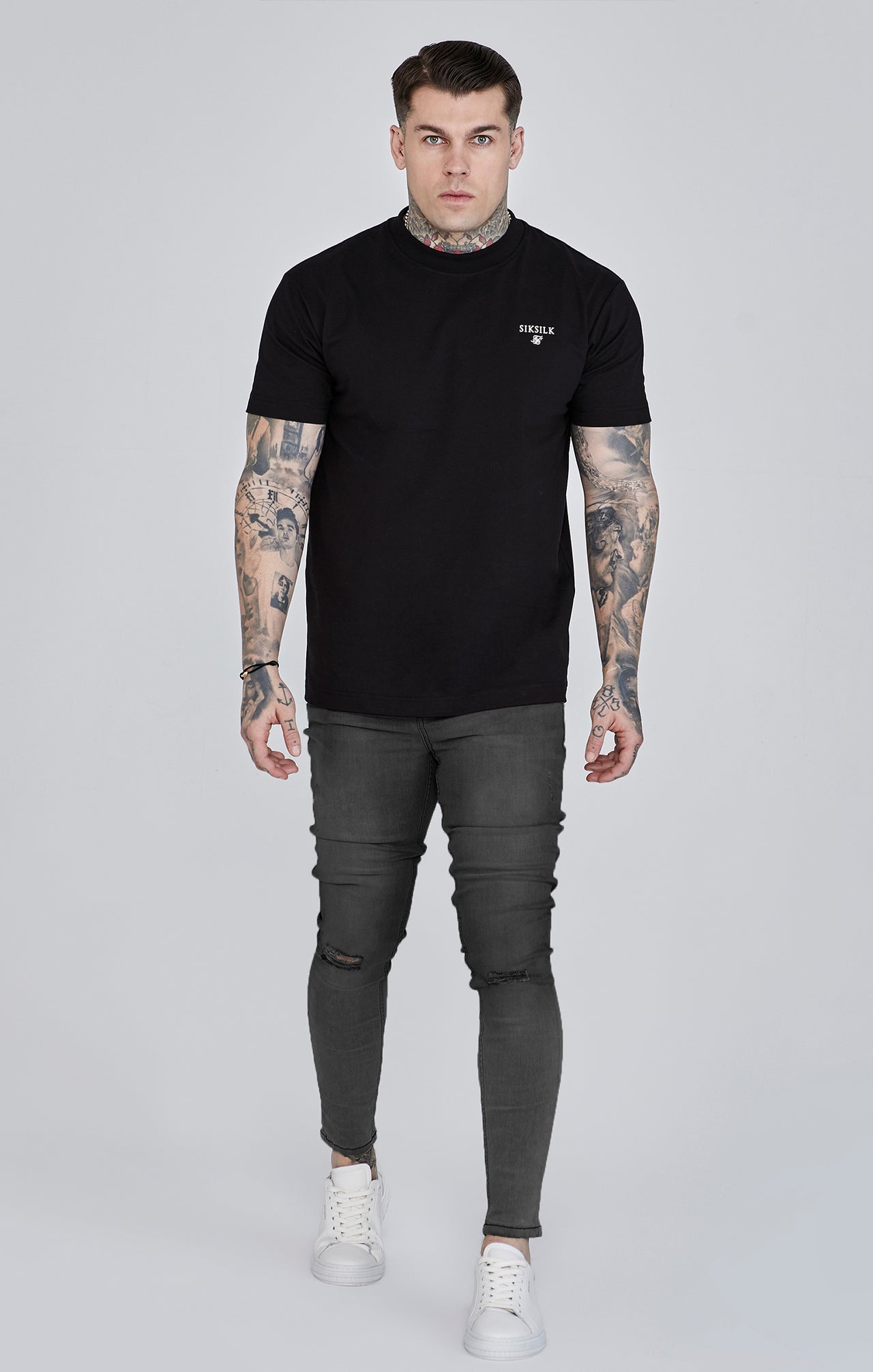Distressed skinny jeans in gray Jeans SikSilk