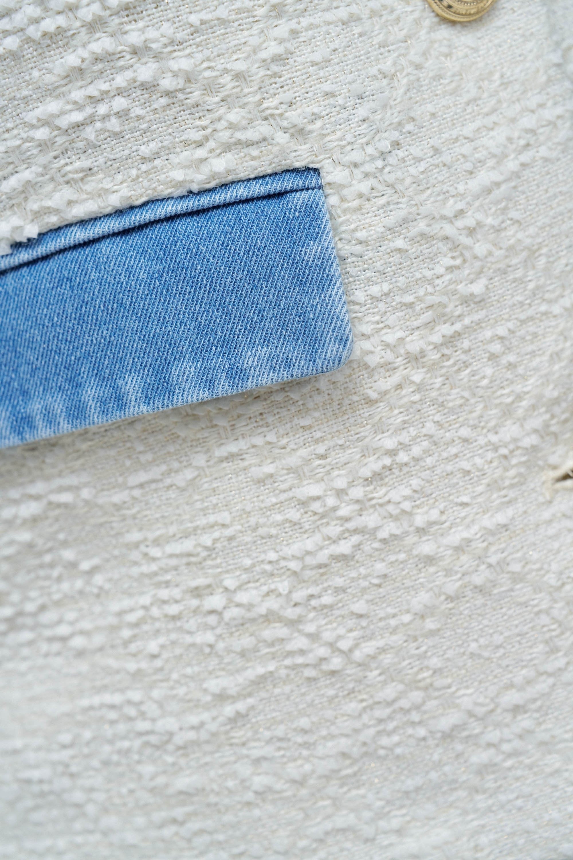 Chanel-style tweed jacket in light beige