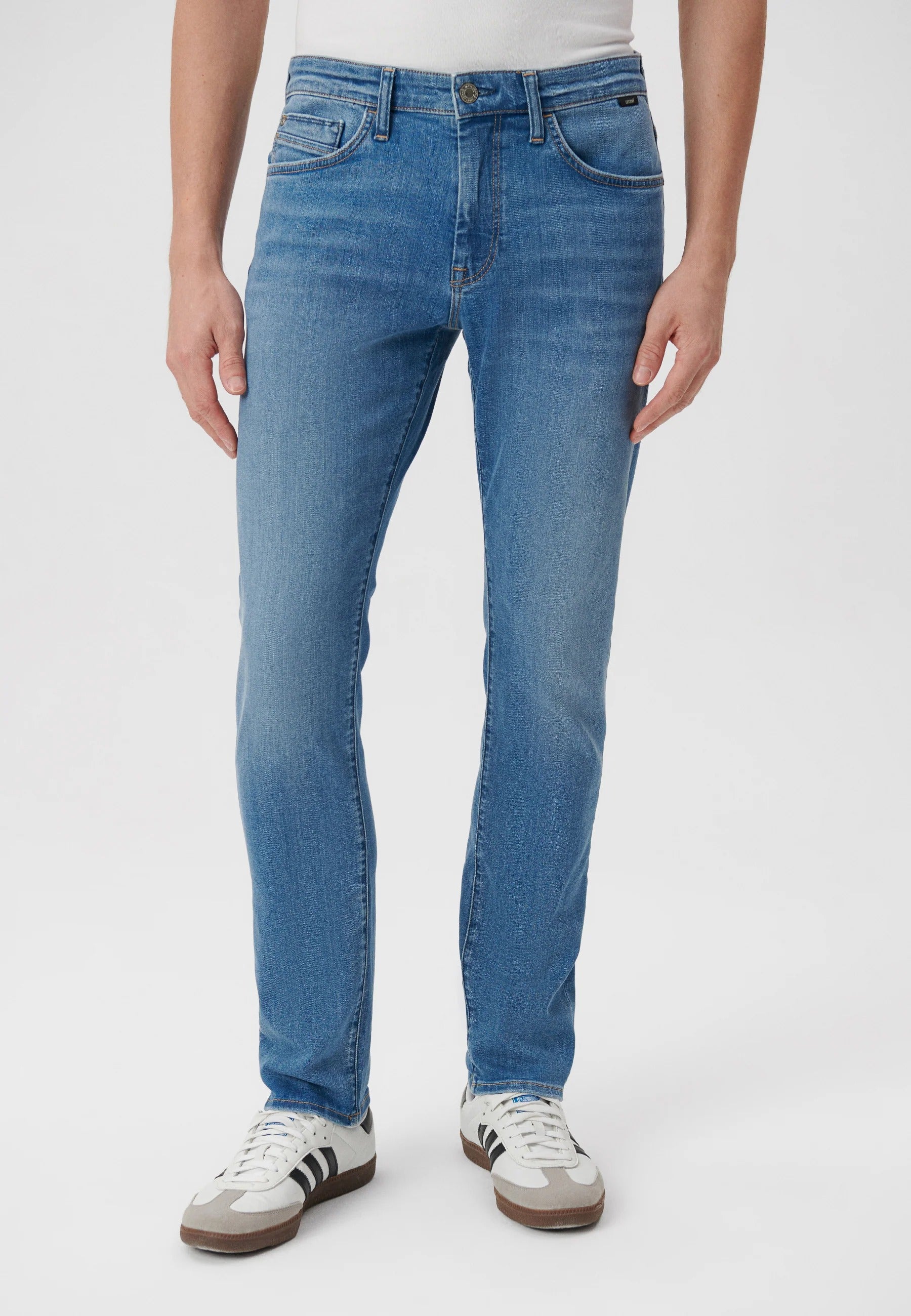 Jake in mid-used jeans by Mavi