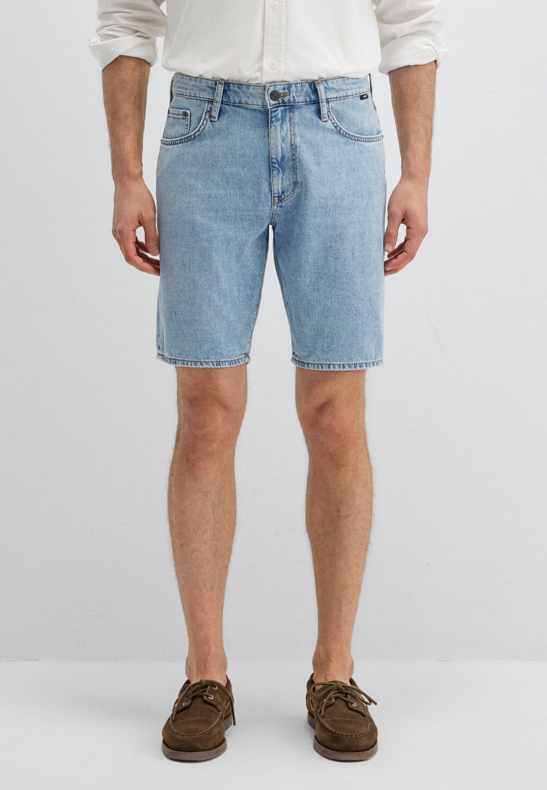 Lucas in Dusty Vintage 90s denim shorts Mavi