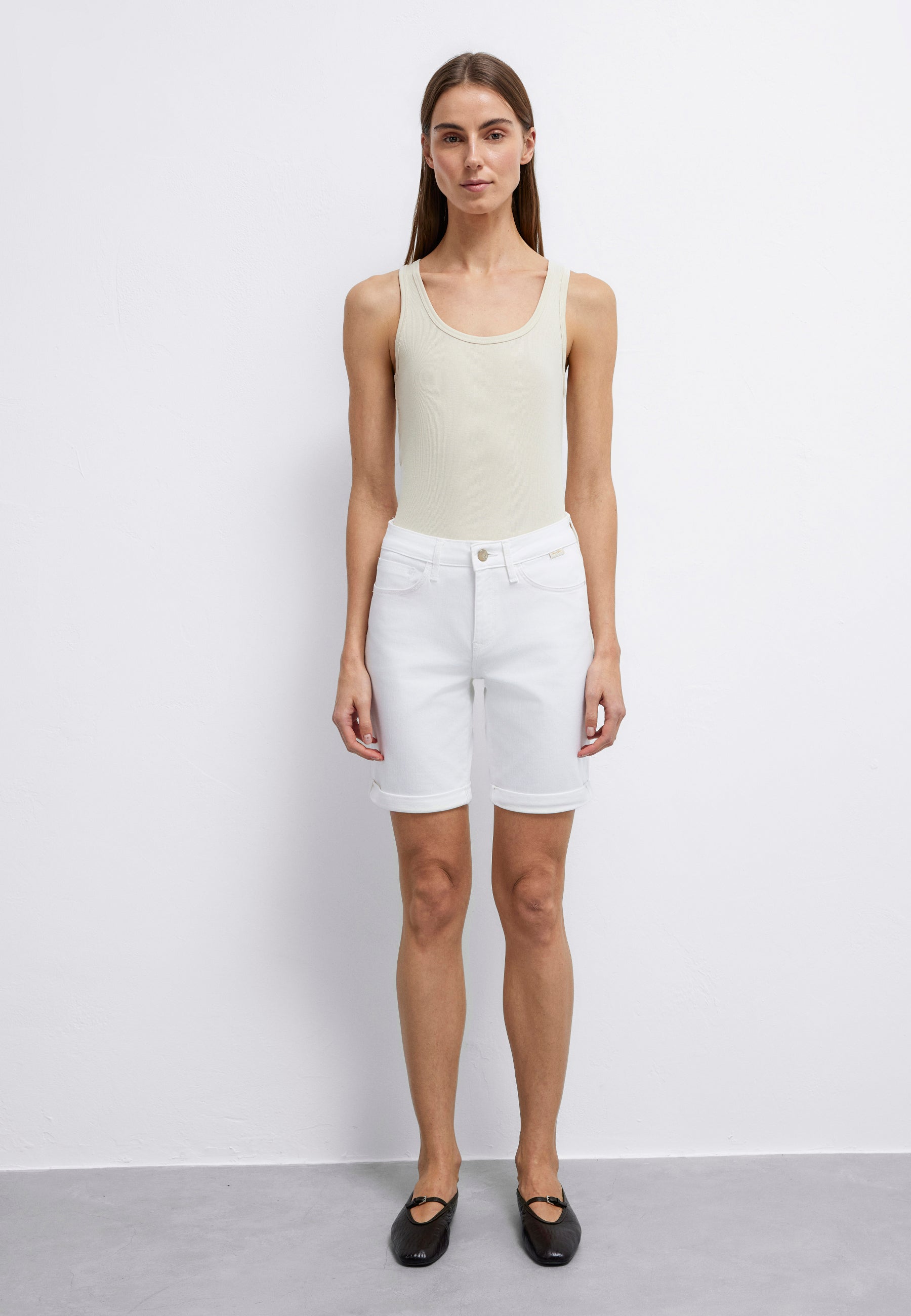 Alexis in white gold denim shorts Mavi