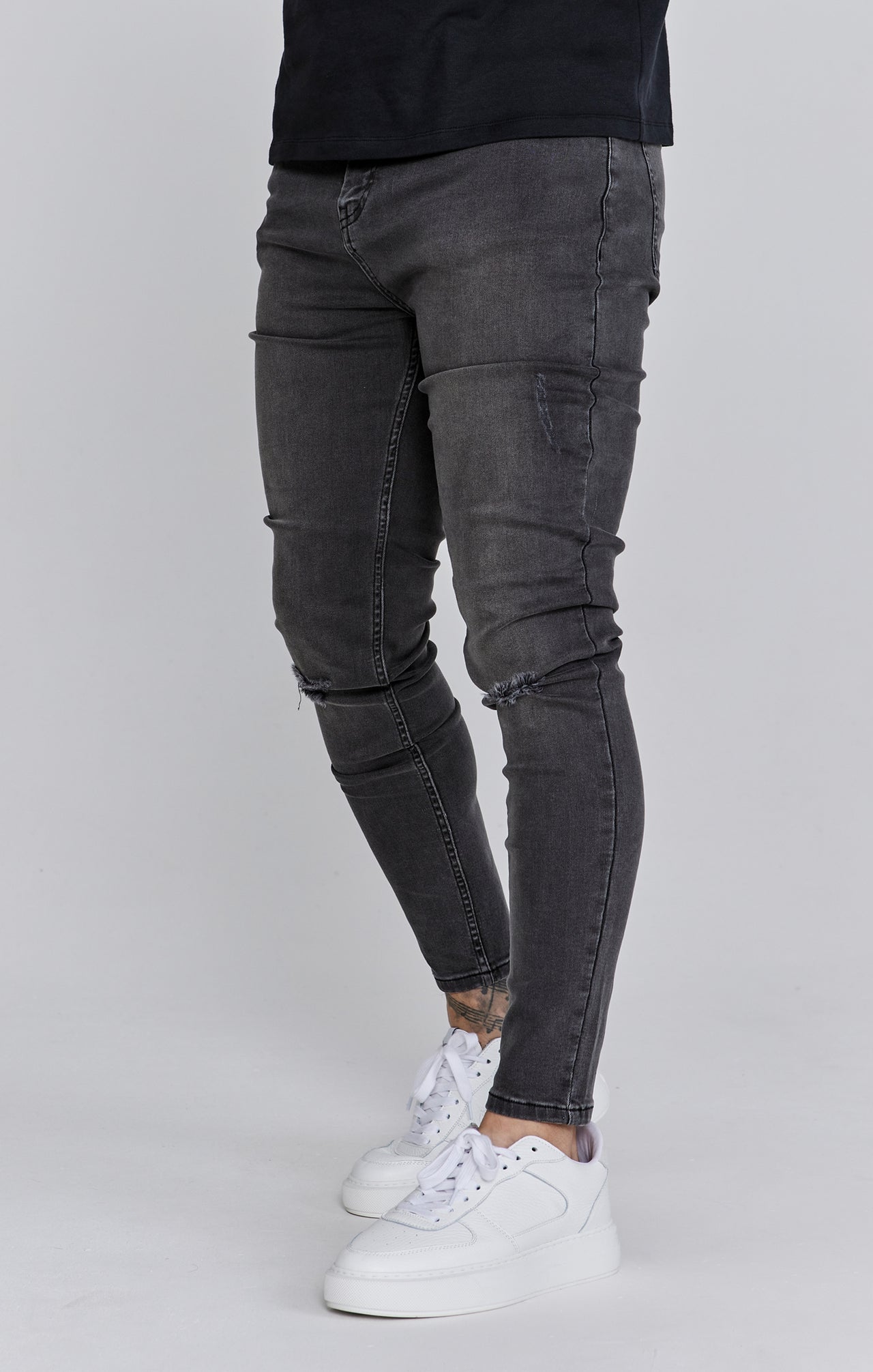 Distressed skinny jeans in gray Jeans SikSilk   