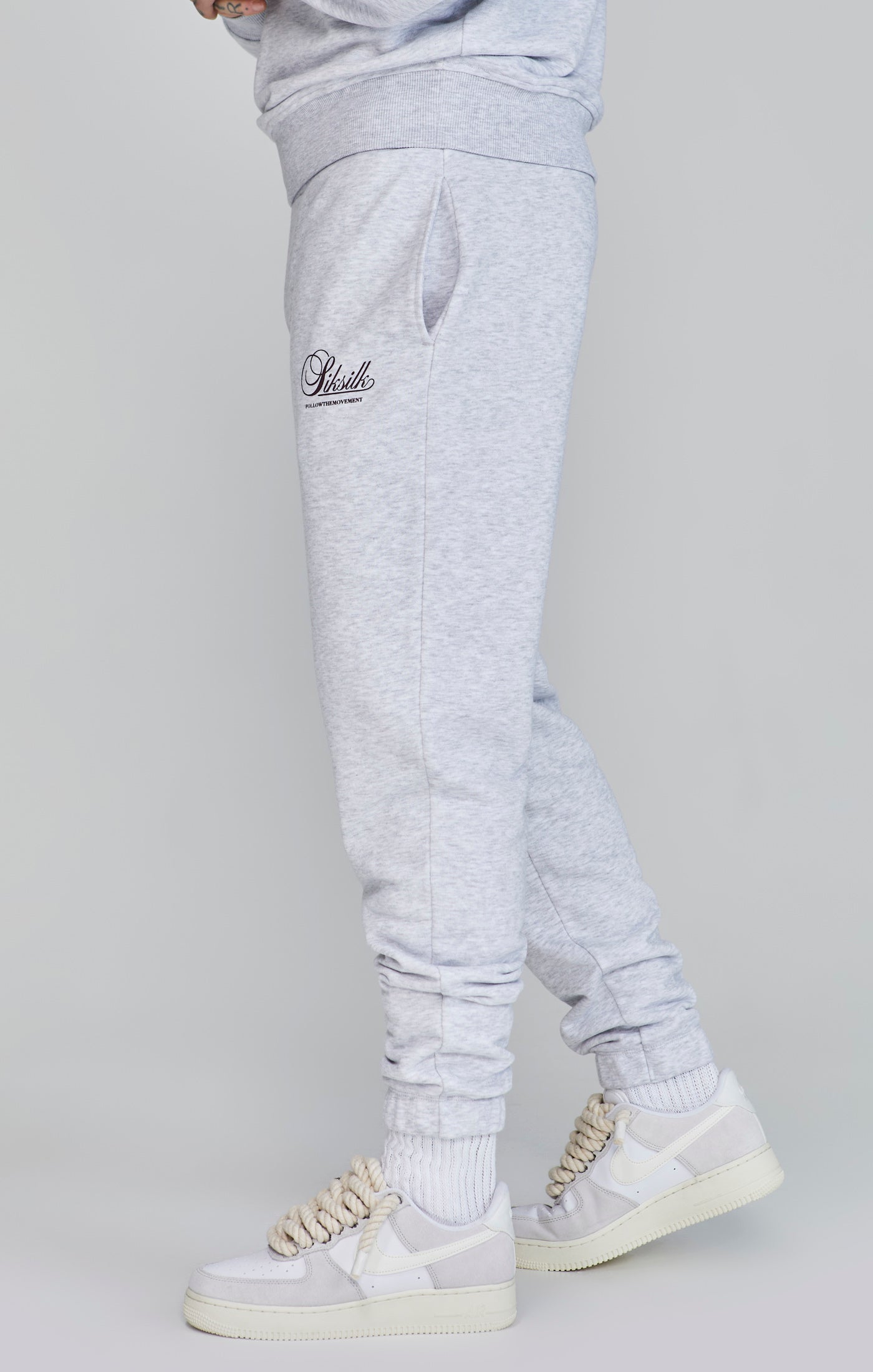 Logo Joggers in Snow Marl Pants SikSilk   